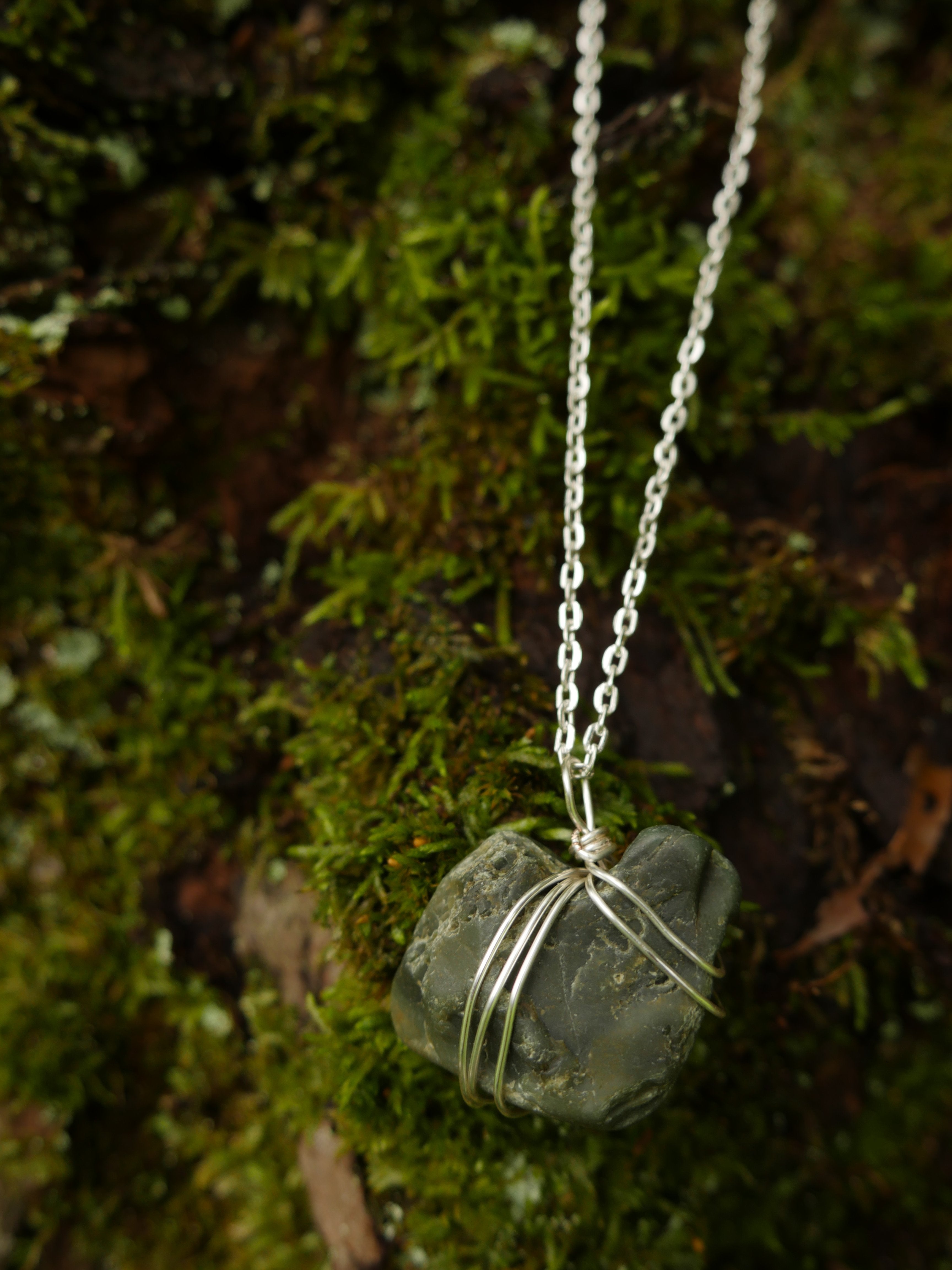 Greenish wire-wrapped stone on stainless steel chain necklace